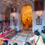 Kolkata, West Bengal, India - 6th October 2019 : 108 lamps are lit , devotees gathered for watching sondhipujo , the sacred ritual at juncture of Ashtami and Nabami, at Shobhabazar Rajbari Durga Puja.