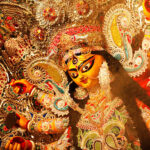 Durga Puja - the ceremonial worship of the mother goddess, is one of the most important festivals of India. Apart from being a religious festival for the Hindus, it is also an occasion for reunion and rejuvenation, and a celebration of traditional culture and customs. While the rituals entails ten days of fast, feast and worship, the last four days - Saptami, Ashtami, Navami and Dashami - are celebrated with much gaiety and grandeur in India and abroad, especially in Bengal, where the ten-armed goddess riding the lion is worshipped with great passion and devotion.